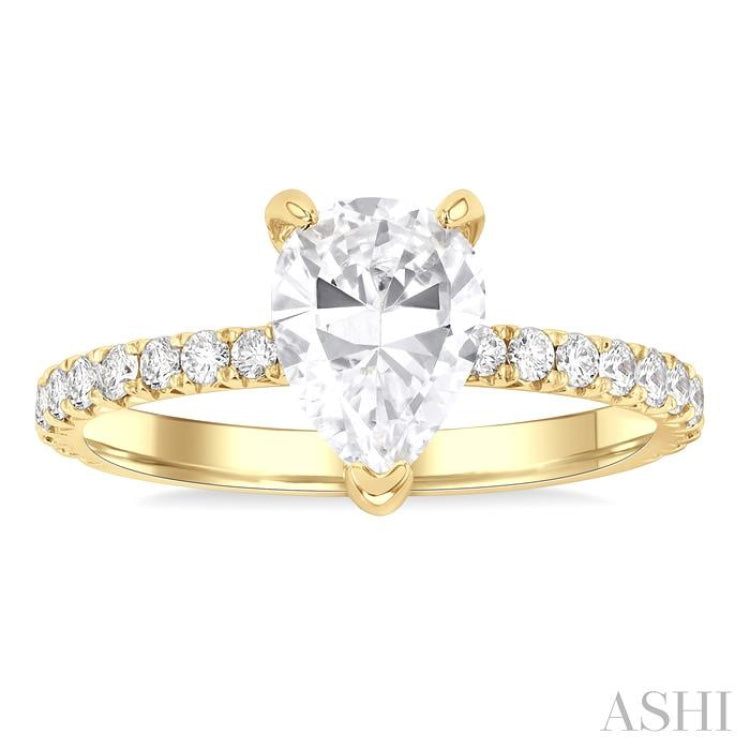 5/8 Ctw Round Cut Diamond Pear Shape Semi-Mount Engagement Ring in 14K Yellow Gold