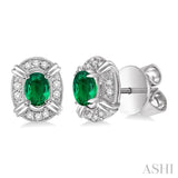 5x3 MM Oval Cut Emerald and 1/10 Ctw Round Cut Diamond Earrings in 10K White Gold