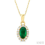 1/20 ctw Round Cut Diamond and 5X3MM Oval Shape Emerald Halo Precious Pendant with Chain in 10K Yellow Gold