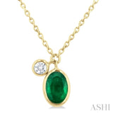 1/20 ctw Oval Cut 6X4MM Emerald and Bezel Set Round Cut Diamond Precious Necklace in 14K Yellow Gold